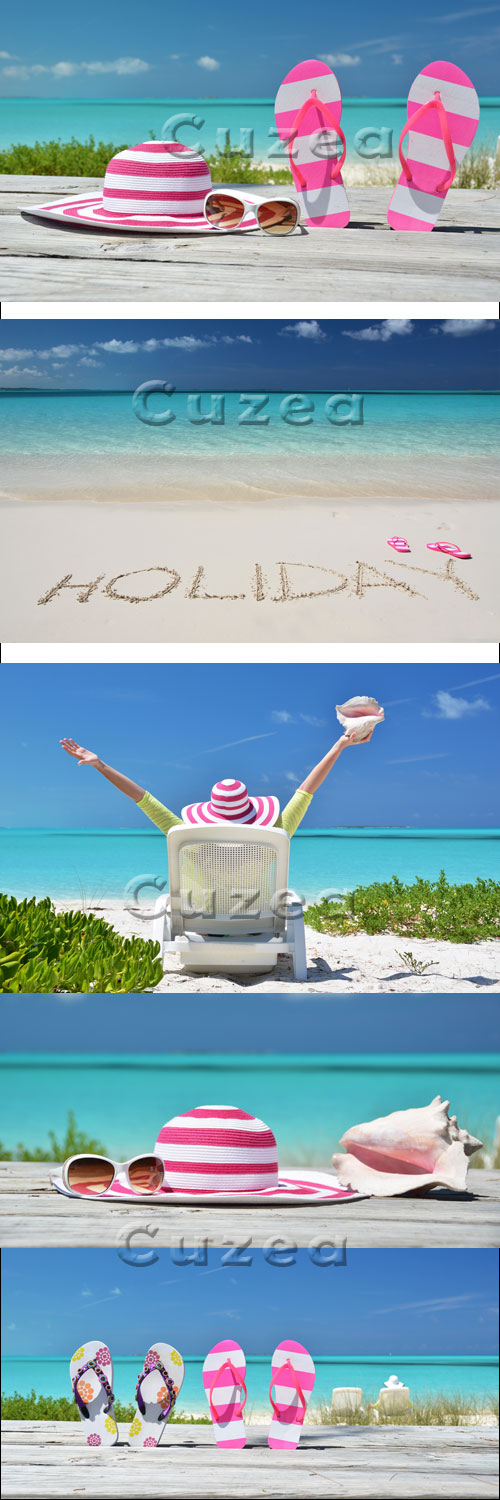   / HOLIDAY writing on the sandy beach - stock photo