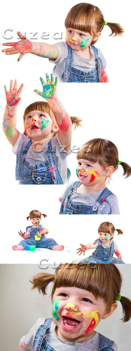     / Small girl with color hands - stock photo